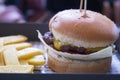 beef burger and potato chips on cafe table Royalty Free Stock Photo