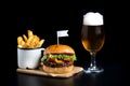 Beef Burger salad bun flag french fries beer glass Royalty Free Stock Photo