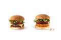 Beef burger vs chickpea burger Royalty Free Stock Photo