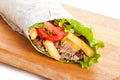 Beef burrito with peppers, fried potato and tomato Royalty Free Stock Photo