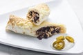 beef burrito with rice and beans served with whipped cream and jalapenos Royalty Free Stock Photo