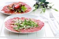 Beef Carpaccio with arugula and parmesan Royalty Free Stock Photo