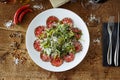 Beef carpaccio. Borettane onion, sun-dried tomato, truffle dressing, arugula salad, parmesan cheese. Italian traditional