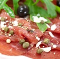 Beef carpaccio with pepper, rucola and parmesan