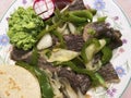 Beef Cecina Dinner With Onions, Green Pepper, Guacamole, Tortilla and Radish