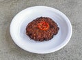 beef chappal kabab served in plate isolated on grey background top view of pakistani and indian spices food