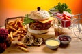 Beef Cheese burger with french fries, potato and tomato slice isolated on wooden board slide view on table fast food