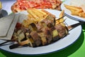 Beef eggplant meat skewer French fries barbeque grill Royalty Free Stock Photo