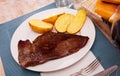 Beef entrecote with baked potato in skins Royalty Free Stock Photo