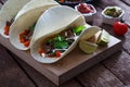 Beef Fajitas with colorful bell peppers in pan and tortilla bread and sauces Royalty Free Stock Photo
