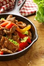 Beef Fajitas with colorful bell peppers in pan