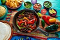 Beef fajitas in a pan sauces chili and sides Mexican Royalty Free Stock Photo