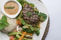 Beef filet steak served with rice, vegetables, and mushroom