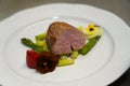 Beef fillet with gravy and vegetables. Fillet of mignon with spring asparagus. Immagine di un filetto di bistecca su un letto di Royalty Free Stock Photo