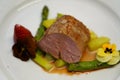 Beef fillet with gravy and vegetables. Fillet of mignon with spring asparagus. Immagine di un filetto di bistecca su un letto di Royalty Free Stock Photo