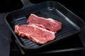 Beef fillet on grill , Beef steaks being prepared on grill , cooking meat steaks on kitchen Royalty Free Stock Photo