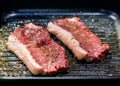 Beef fillet on grill , Beef steaks being prepared on grill , cooking meat steaks on kitchen Royalty Free Stock Photo
