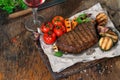 Beef grilled steak with grilled vegetables and red wine Royalty Free Stock Photo