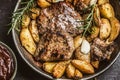 Beef grilled steaks with barbecue sauce roasted potatoes and rosemary Royalty Free Stock Photo