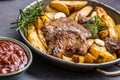 Beef grilled steaks with barbecue sauce roasted potatoes and rosemary Royalty Free Stock Photo