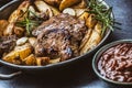 Beef grilled steaks with barbecue sauce roasted potatoes and rosemary Royalty Free Stock Photo