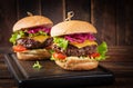 Hamburger. Sandwich with beef burger, tomatoes, cheese, pickled cucumber and lettuce. Cheeseburger Royalty Free Stock Photo