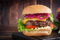 Hamburger. Sandwich with beef burger, tomatoes, cheese, pickled cucumber and lettuce. Cheeseburger Royalty Free Stock Photo