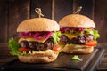 Hamburger. Sandwich with beef burger, tomatoes, cheese, pickled cucumber and lettuce. Cheeseburger Royalty Free Stock Photo