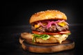 Sandwich with beef burger, tomatoes, cheese, pickled cucumber and lettuce. Cheeseburger Royalty Free Stock Photo