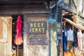 The Beef Jerky Shop with clothes hanging in a shop at The River Street Market Place on River Street in Savannah Georgia