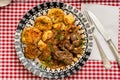 Beef kidney, leek and onion stew with Spanish style potatoes served on a vintage plate Royalty Free Stock Photo