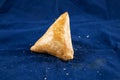 Beef Kolija Shingara or samosa, singara, somucha isolated on blue background side view of savory snack food