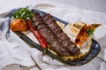 beef, lamb or mutton seekh kabab meat kebab with pita bread, tomato and onion served in dish isolated on food table top view of Royalty Free Stock Photo