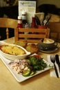 Beef lasagne served with a side salad