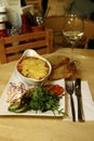 Beef lasagne served with a side salad