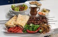 Beef liver kebab with vegetables and ayran