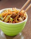 Beef lo mein in a bowl with chopsticks