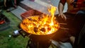 Beef meat barbecue on a metal grilled with open fire