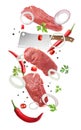 Beef meat, different spices and cleaver knife falling on white background Royalty Free Stock Photo