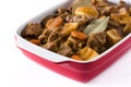 Beef meat stewed with potatoes, carrots and spices in ceramic pot isolated Royalty Free Stock Photo