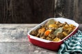 Beef meat stewed with potatoes, carrots and spices in ceramic pot on wood Royalty Free Stock Photo