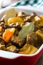 Beef meat stewed with potatoes, carrots and spices in ceramic pot Royalty Free Stock Photo