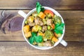 Beef meat stewed with vegetables in ceramic pot on wooden background Royalty Free Stock Photo