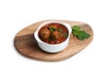 Beef meatballs with tomato sauce in white bowl on wooden serving board. Light background, copy space Royalty Free Stock Photo