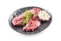 Beef meeat Rib-Eye steak wit rosemary salt and pepper in black plate isolated on white Royalty Free Stock Photo