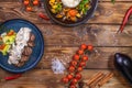 Beef patty on a platter with vegetables, stewed vegetables with rice, lettuce, bell pepper, rosemary, garlic and sesame Royalty Free Stock Photo