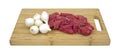 Beef and pearl onions on cutting board Royalty Free Stock Photo