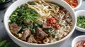 Beef Pho Noodle Soup with Fresh Herbs and Chili