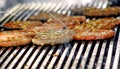 Beef or pork meat with chehese barbecue burgers for hamburger prepared grilled on bbq fire flame grill Royalty Free Stock Photo