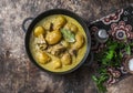 Beef potato massaman curry in a frying pan on wooden background, top view. Comfort, delicious food Royalty Free Stock Photo